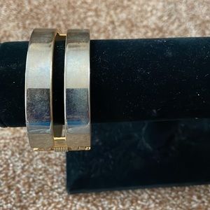 Gold tone cuff bracelet with hinge closing